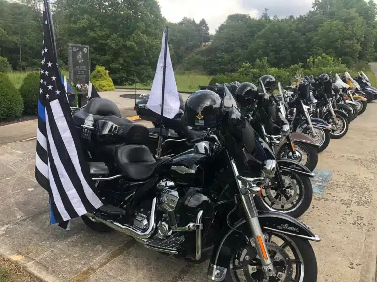 Blue Knights Kentucky XI member's motorcycles lined up after a charity ride